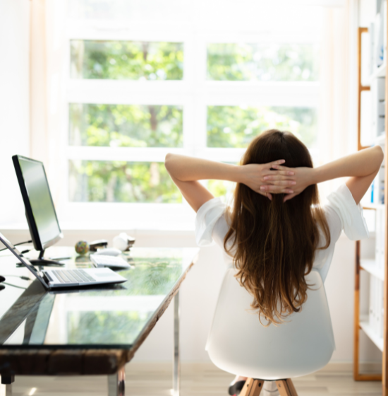 woman stretching at desk