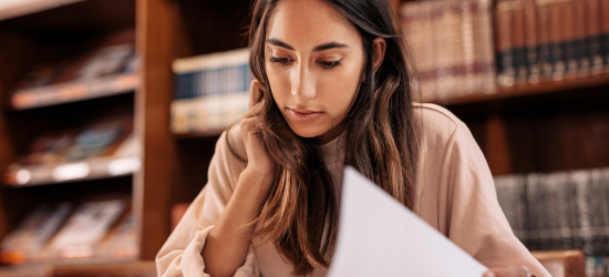 woman studying in library