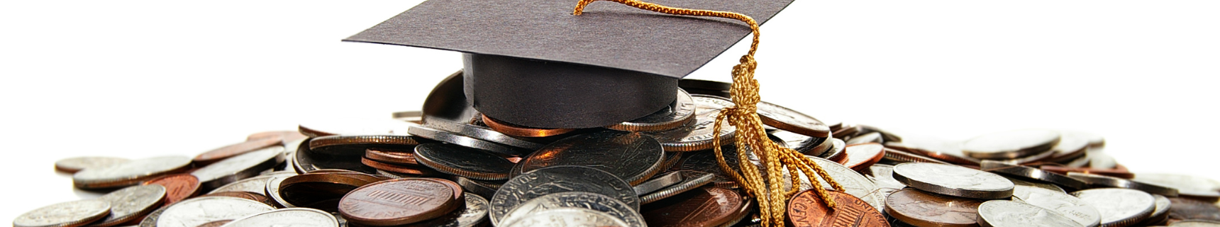 graduation cap on top of coins